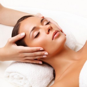 Face Massage.  Close-up of a Young Woman Getting Spa Treatment.